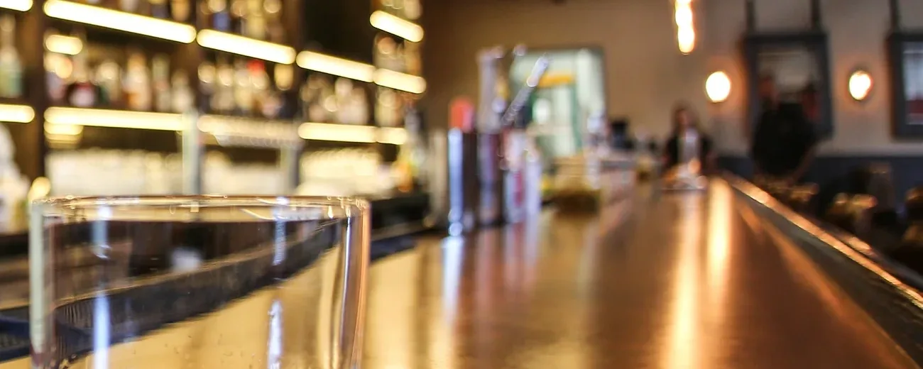 The bar at The Whisper House seen down its length